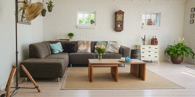 a-cozy-living-room-with-a-large-sectional-sofa-wooden-coffee-table-and-decorative-plants a-cozy-living-room-with-a-large-sectional-sofa-wooden-coffee-table-and-decorative-plants