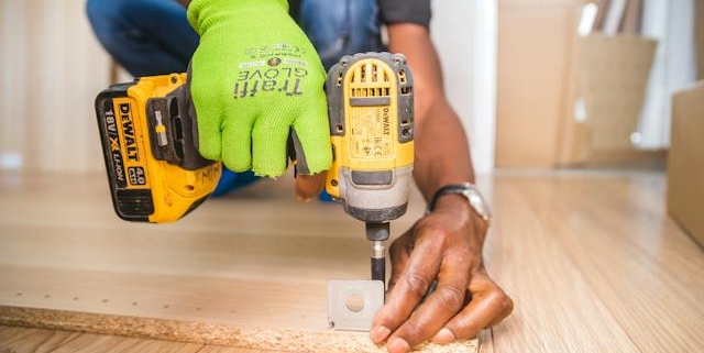 a-worker-using-a-screwdriver-to-repair-things-in-the-house