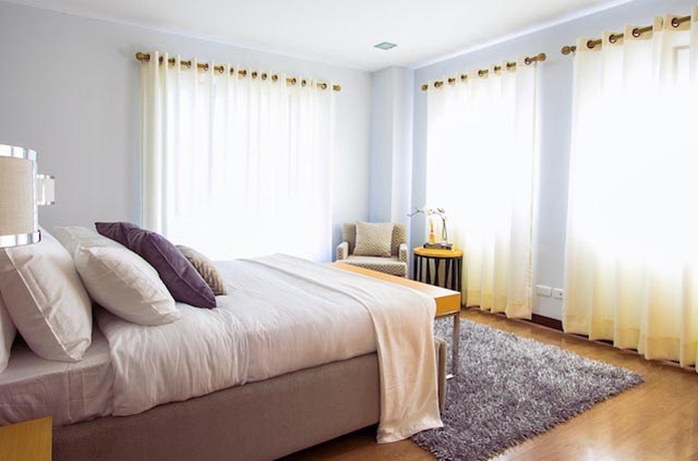 bedroom-with-bed-and-curtains bedroom-with-bed-and-curtains