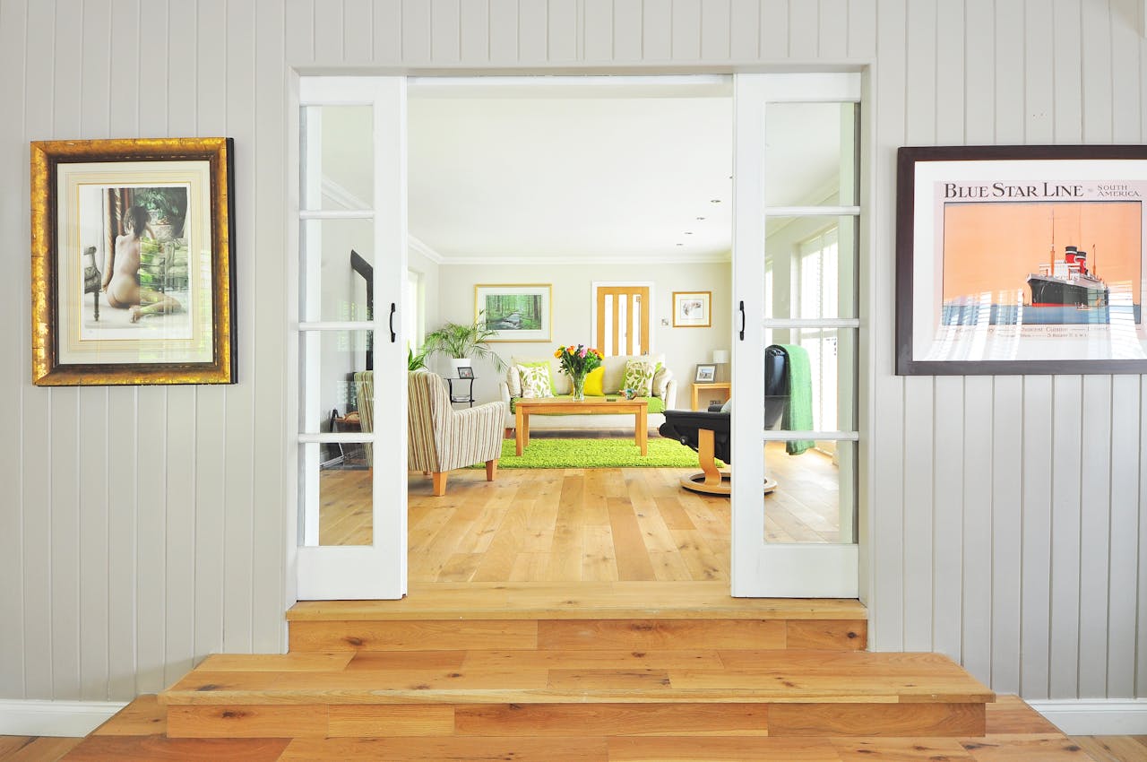 doorway-looking-into-white-living-room-with-green-rug doorway looking white living room