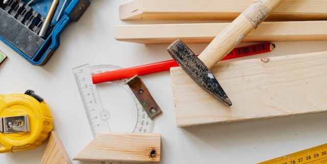 woodworking-tools-and-materials-on-white-surface